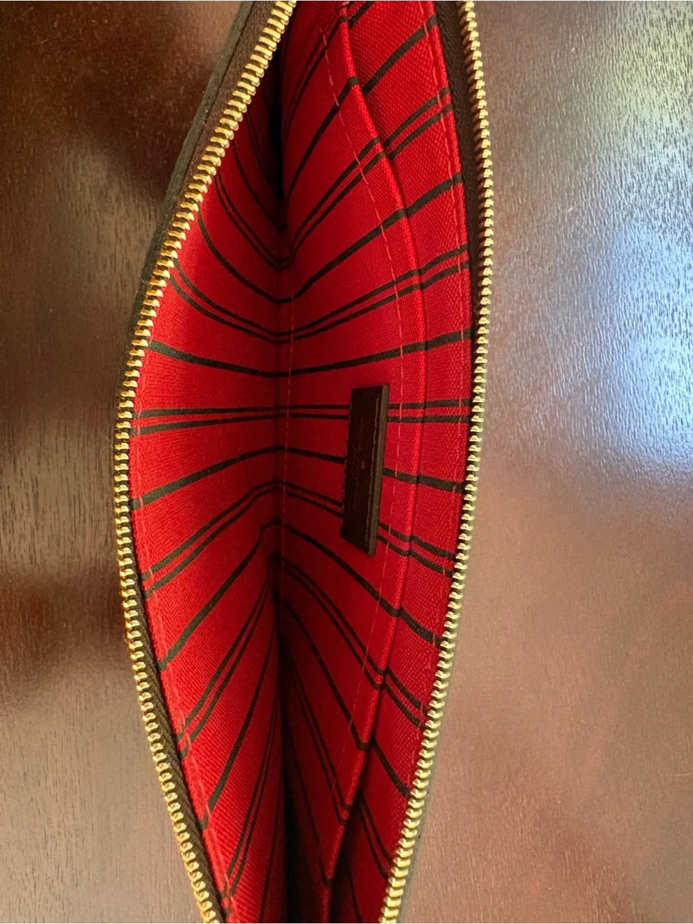 Never used Louis Vuitton Neverfull pouch